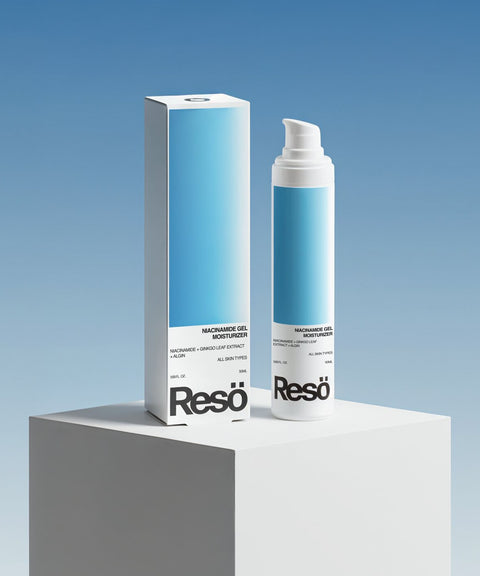 A tall white bottle and box of RESÖ Niacinamide Gel Moisturiser for sensitive skin stand on a white pedestal against a blue gradient background, featuring minimalist blue and white packaging.