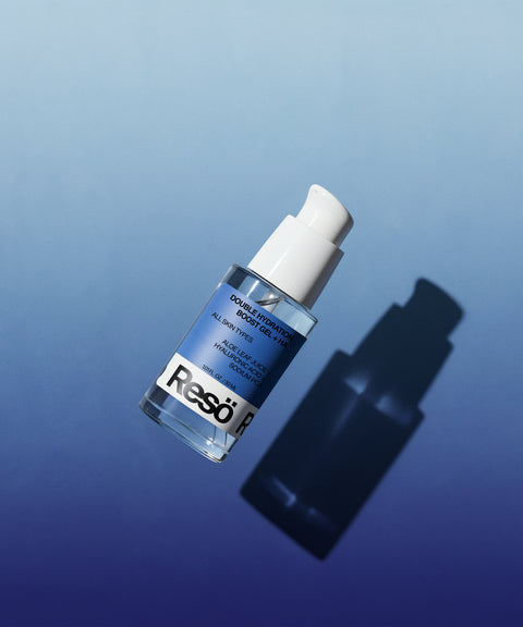 A blue and clear pump bottle of Resö skincare serum is displayed against a gradient blue background with a shadow cast to the right.