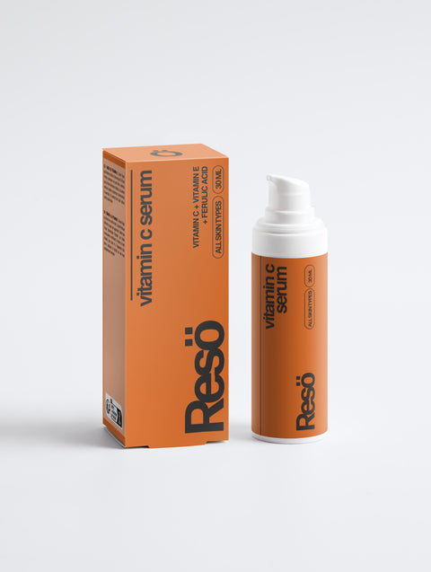 An orange bottle and box of RESÖ Vitamin C Serum for all skin types sit on a white background. Featuring ascorbyl glucoside, bold modern text, and a pump dispenser, this serum brightens skin effectively.