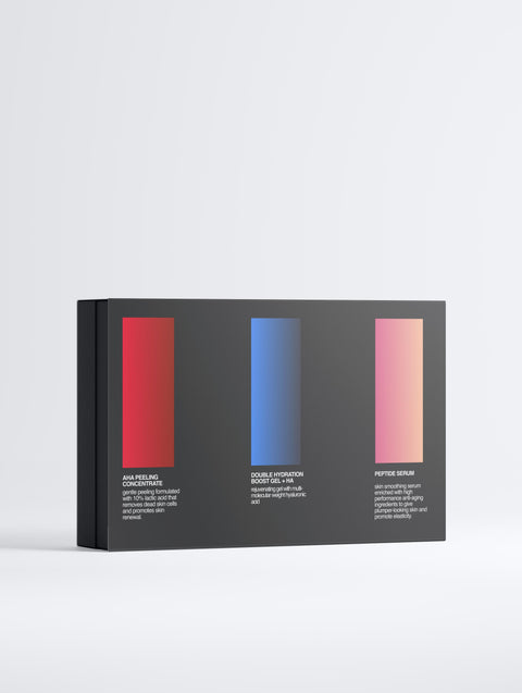 A black RESÖ Ultimate Renewal Collection Box stands against a white background, displaying three vertical color swatches—red, blue, and pink—each labeled with skincare serums like Hyaluronic Hydration Gel and Peptide Serum plus their key benefits.