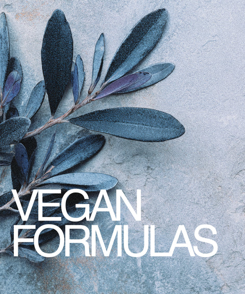 Branch with blue leaves and 'Vegan Formulas' text on a textured gray background